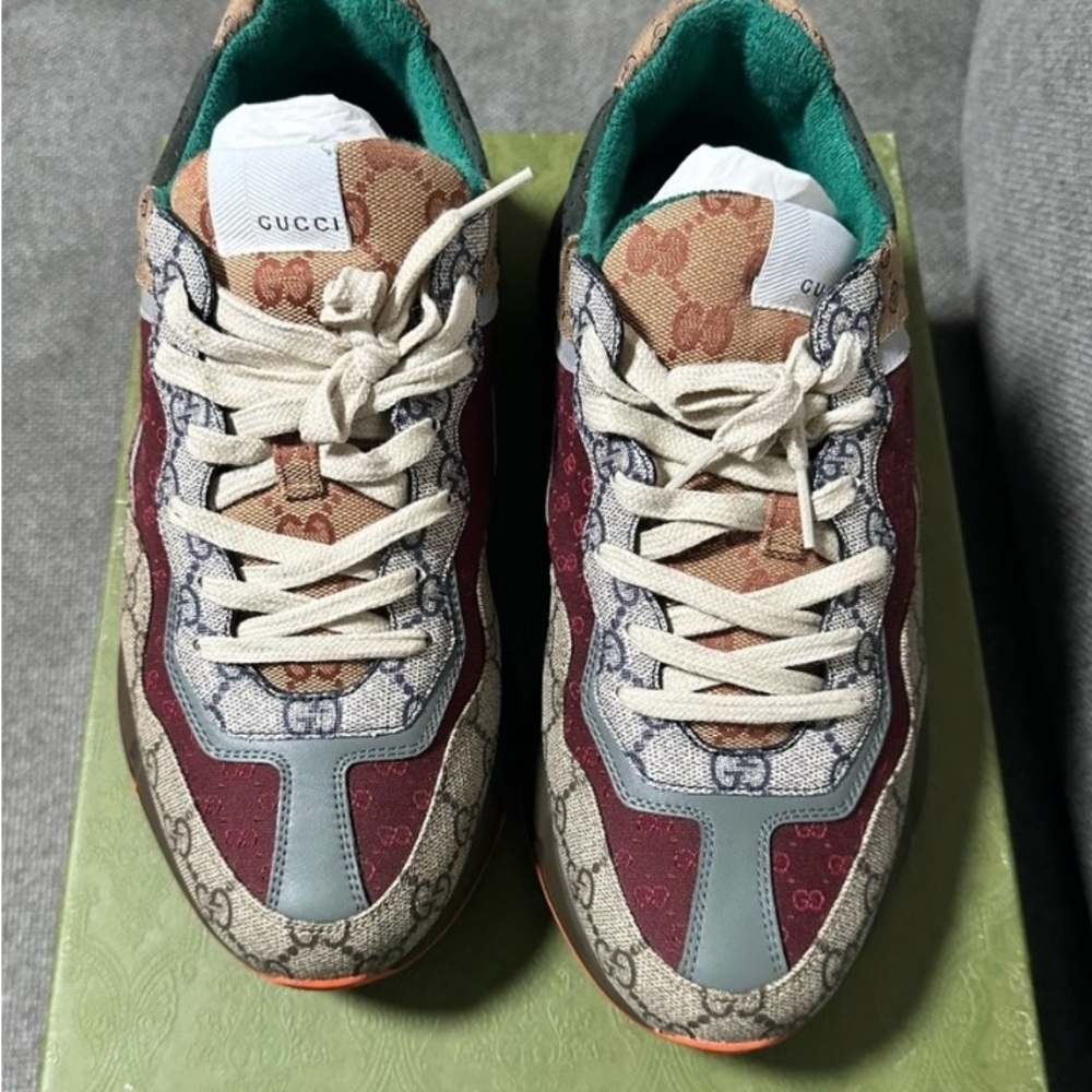 A pair of Authentic Gucci Reyton tennis shoes